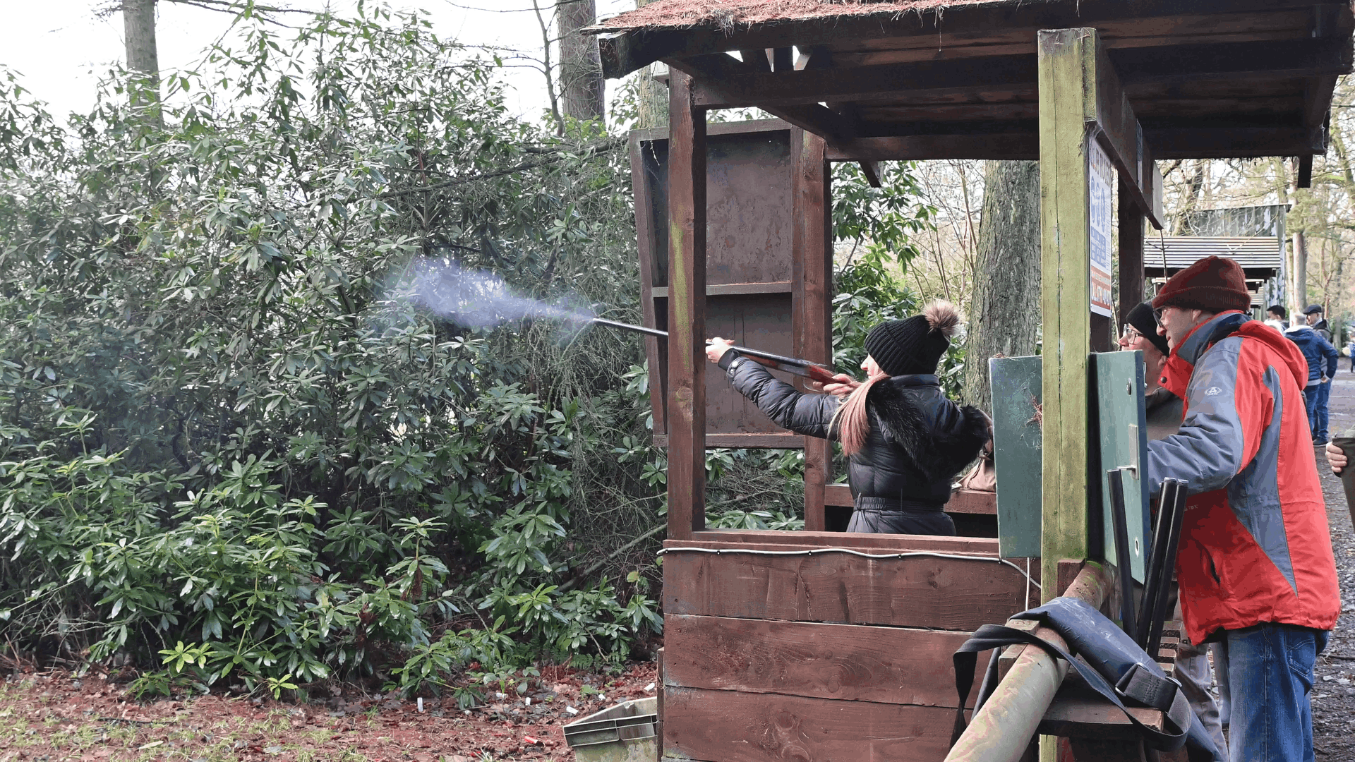 father giving his daughter instruction on her first clay pigeon day at Manchester clay pigeon club
